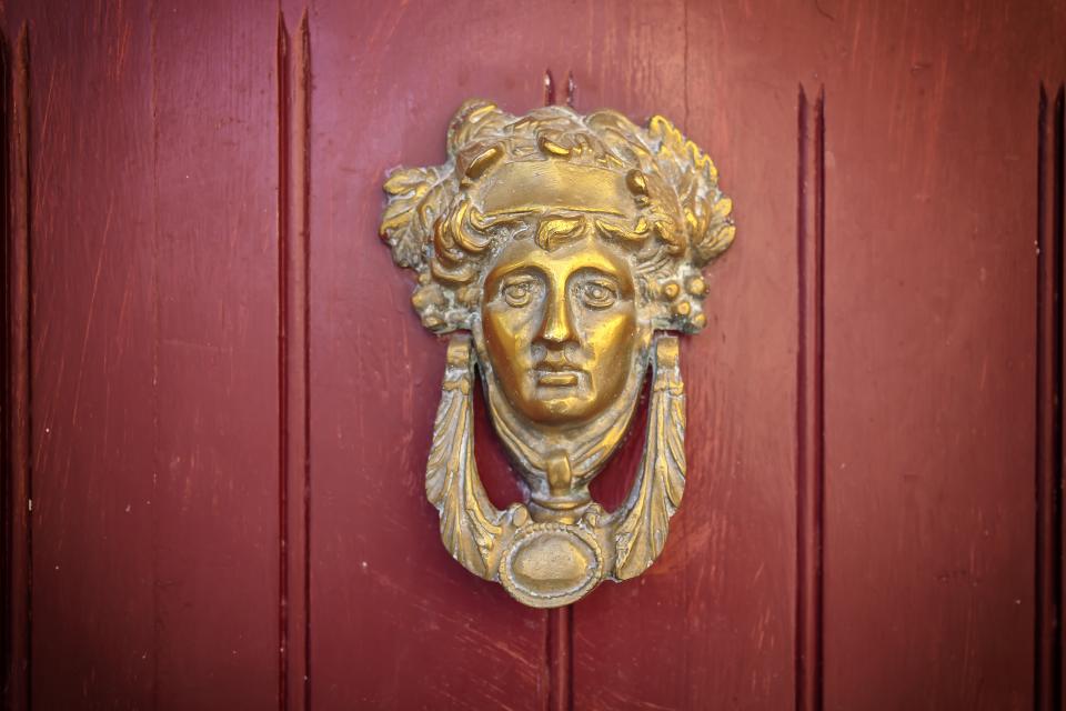 Tarnished Gold Lion Door knocker.